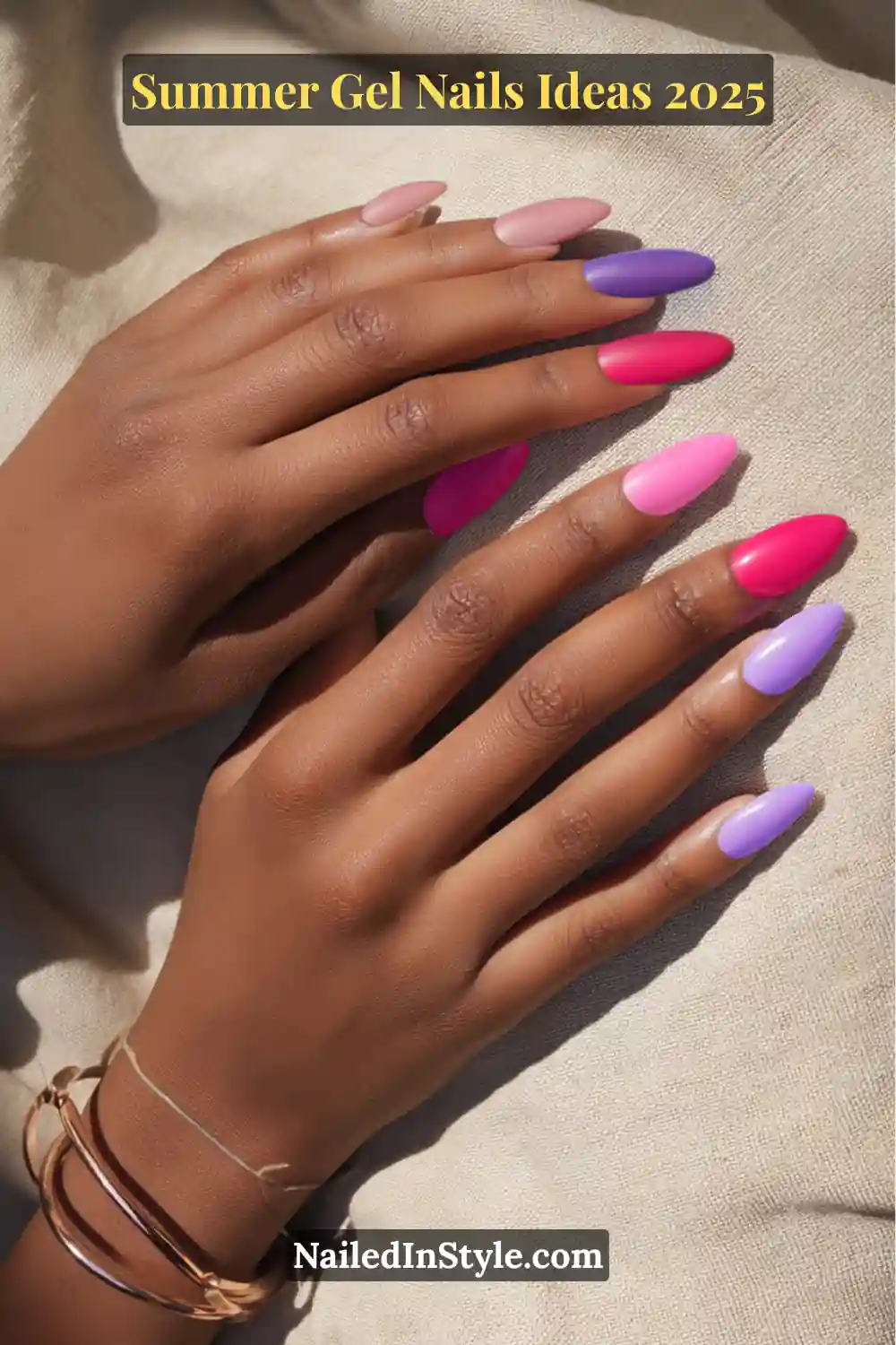 Summer Gel Nails Ideas 2026 9 A close-up of manicured hands with deep skin tone, featuring almond-shaped nails in hot pink, lavender jelly, soft lilac, and electric pink gel polish shades.