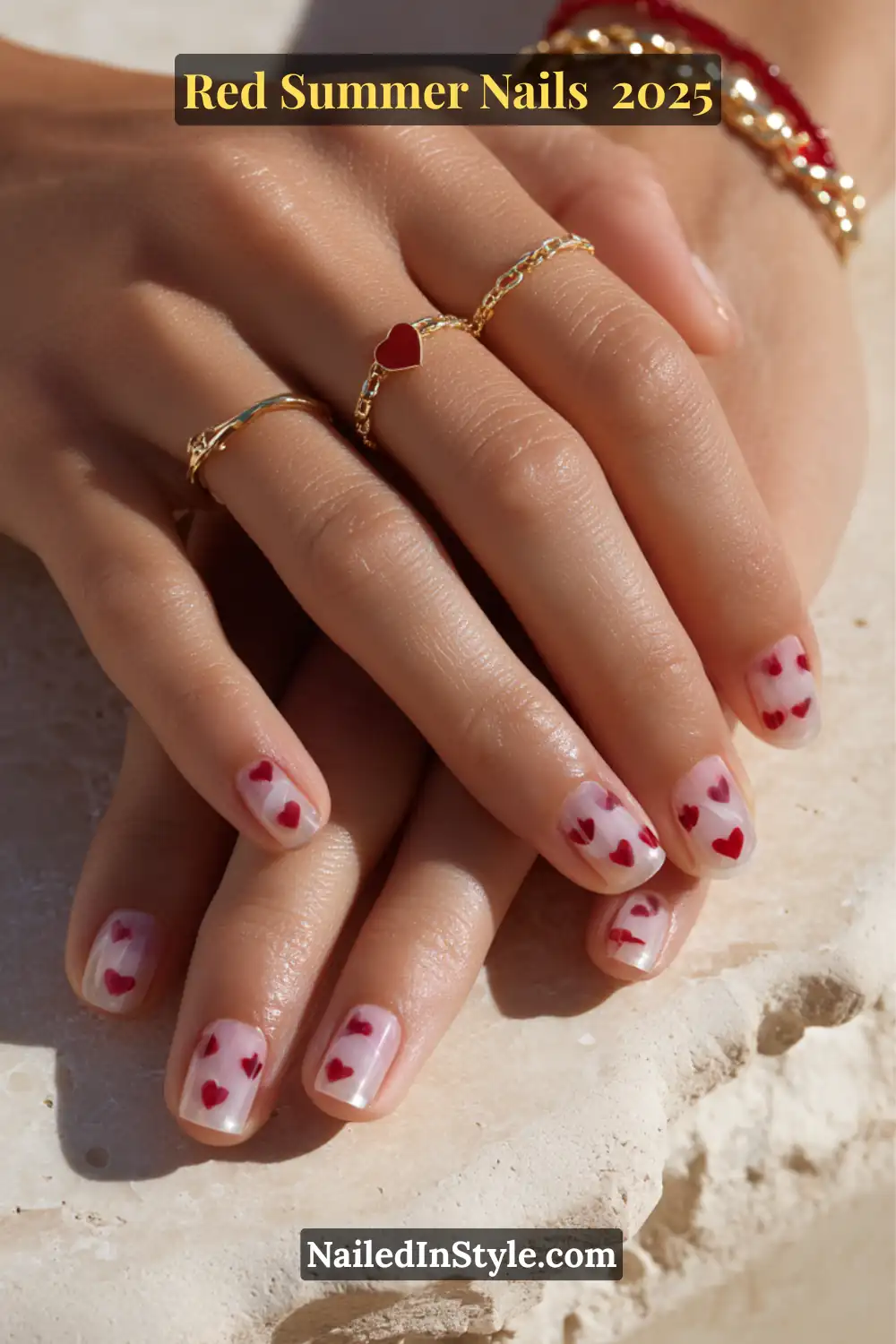 Red Summer Nails 2026: Bold, Fiery & Classic Warm-Weather Looks 23 Close-up of short natural nails with clear base and red heart patterns in a negative space design, perfect for summer 2025