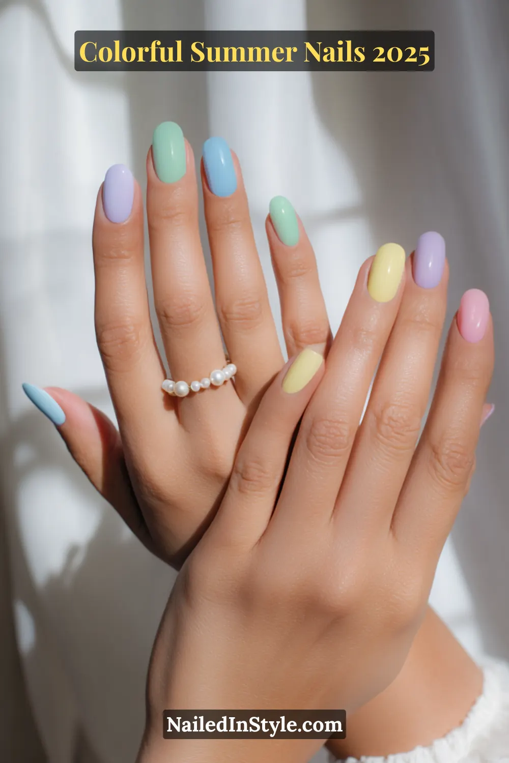 Colorful Summer Nails 2026: Bold, Fun & Bright Manicure Ideas 6 Two hands with light skin tone featuring rounded nails painted in mint green, baby blue, lemon yellow, lilac, and soft pink pastel shades
