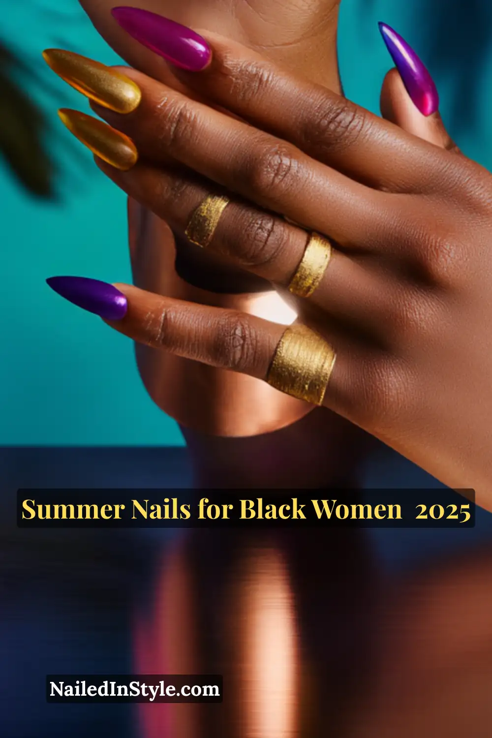 Close-up of a Black woman’s hands with long almond-shaped nails in gold, neon yellow, magenta, and cobalt blue chrome finishes.