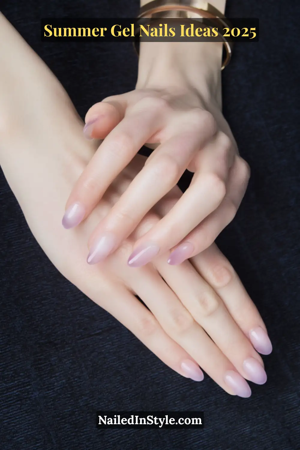 Summer Gel Nails Ideas 2026 15 Close-up of fair-toned hands with almond-shaped nails featuring a soft lavender smoke design created using translucent gel layers.