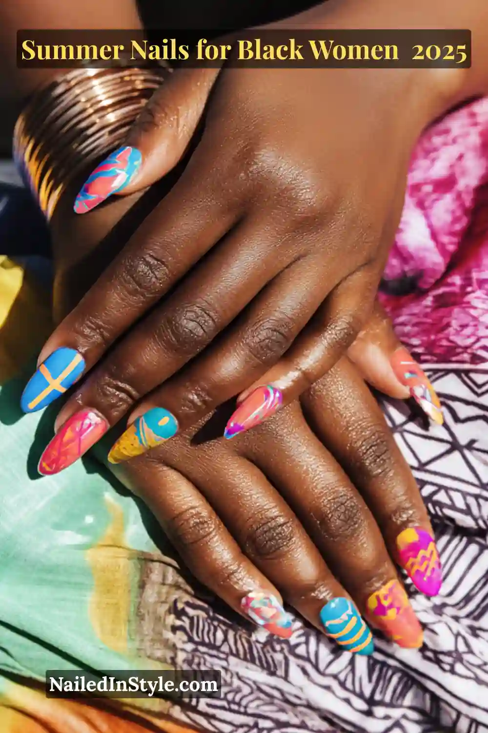Close-up of a Black woman’s hands with colorful summer nail art featuring tie-dye, tribal, and playful graphic designs in vibrant shades of blue, pink, orange, and yellow.
