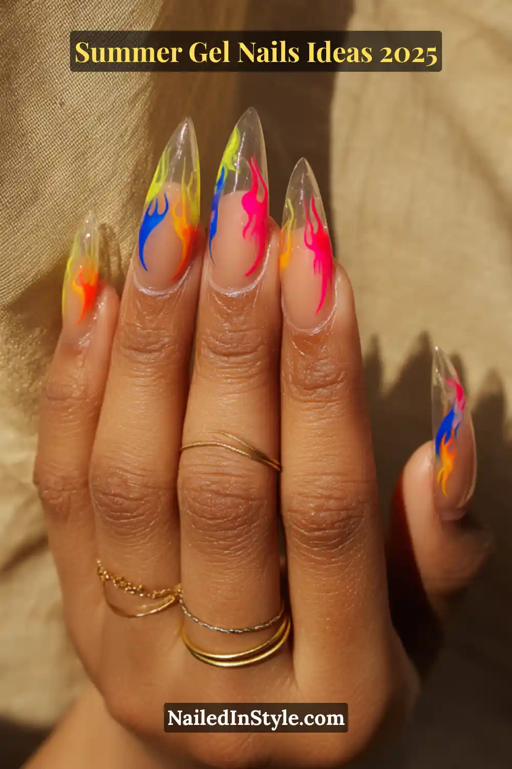 Summer Gel Nails Ideas 2026 16 Close-up of long almond-shaped nails with neon rainbow flame designs over clear gel, perfect for summer 2025 trends.