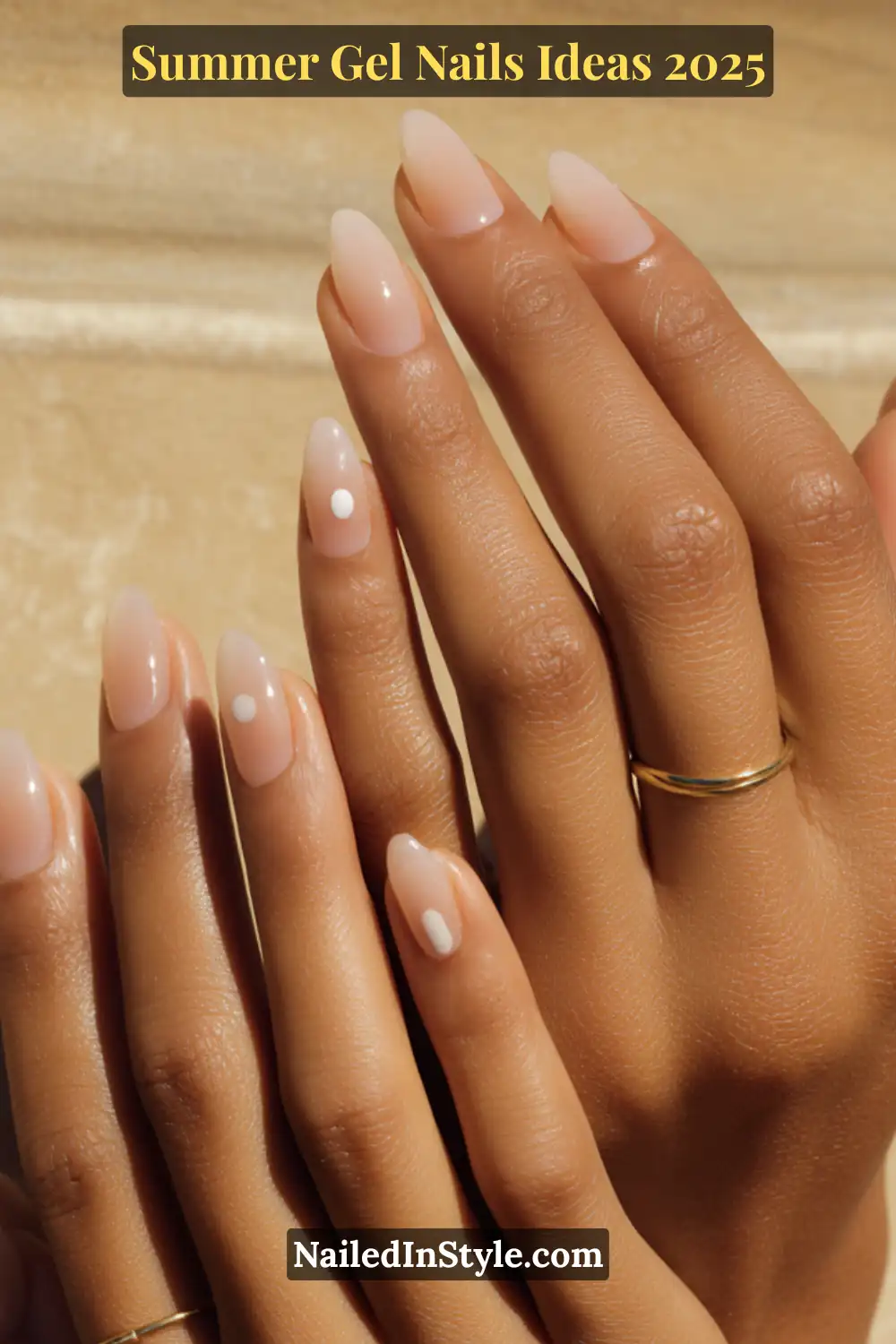 Summer Gel Nails Ideas 2026 20 Hands with jelly beige gel nails featuring simple white dot accents, minimal and elegant for summer.