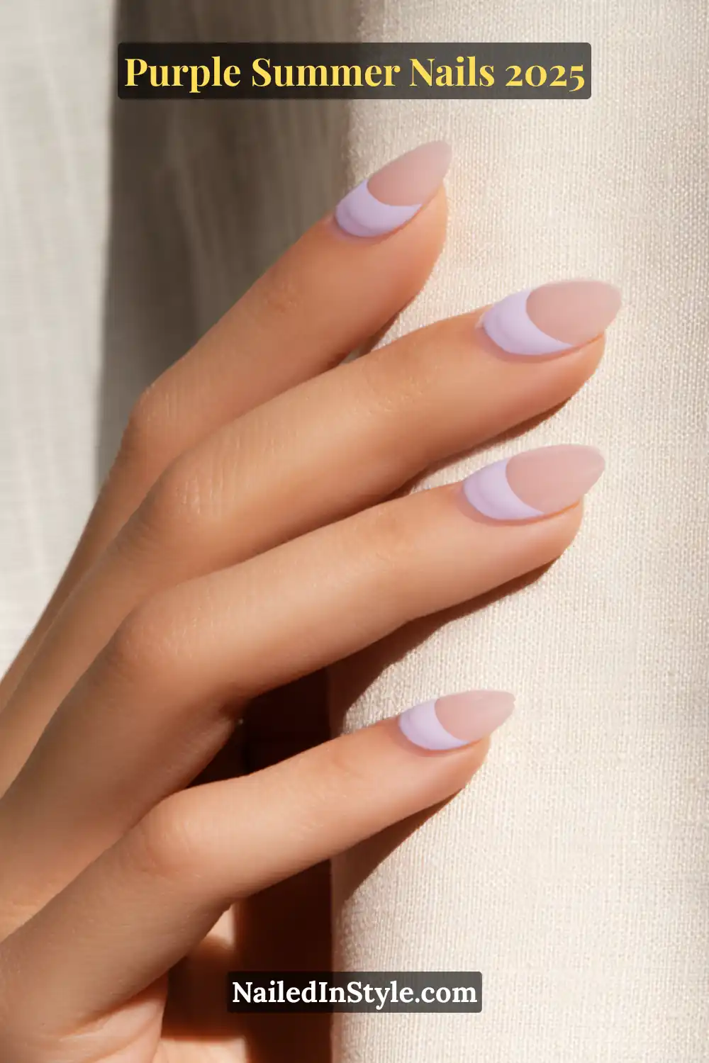Matte nude nails with soft lilac crescent moon tips in an almond shape.