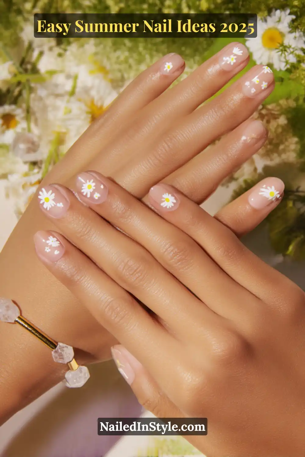Easy Summer Nail Ideas 2026 That Look Gorgeous with Minimal Effort 17 Close-up of short, rounded nails with hand-painted mini daisies—white petals with yellow centers on a sheer pink base; summer floral nail art 2025.
