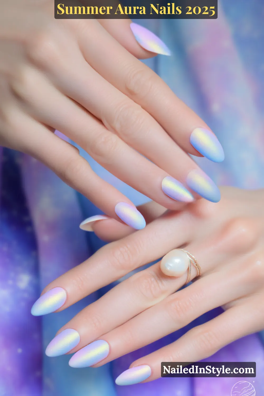 Close-up of hands with almond-shaped nails in lilac and baby blue aura gradient, mystical summer nail design