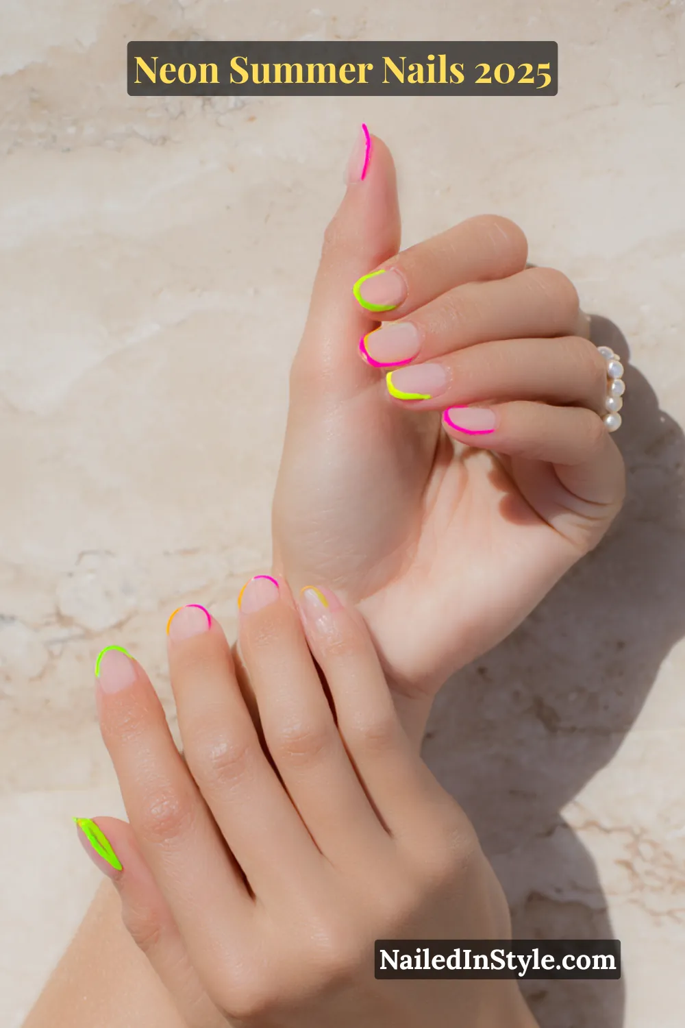 Neon Summer Nails 2026: Bright, Bold & Sun-Soaked Perfection 22 Two hands with natural nails outlined in neon colors including pink, green, and yellow.