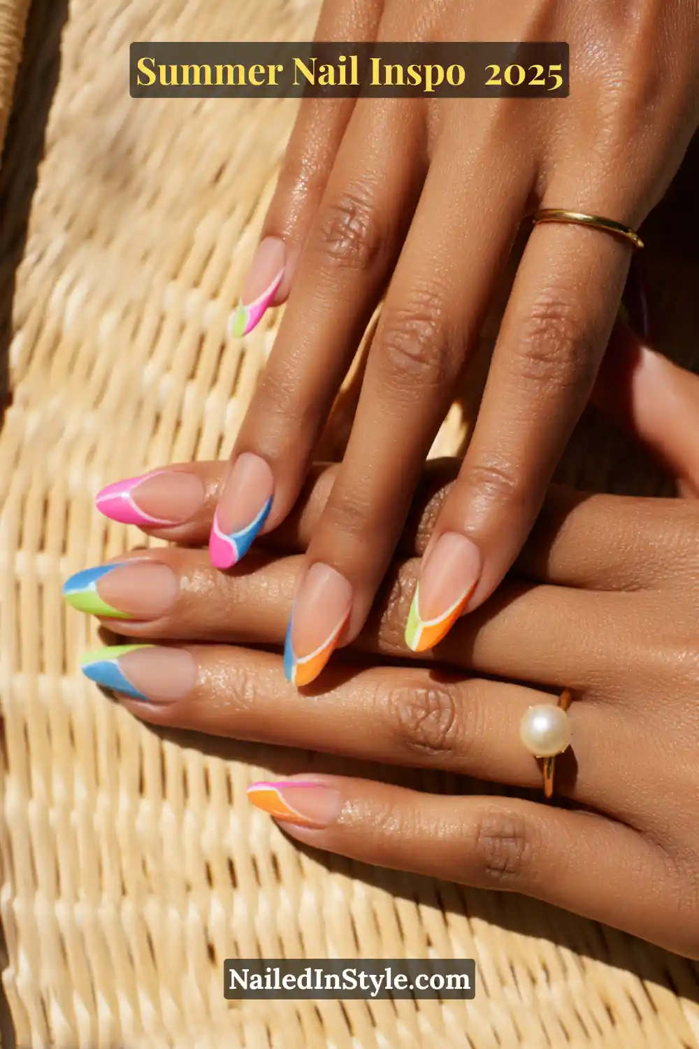 Close-up of hands with almond-shaped nails featuring negative space and colorful neon French swirl tips in pink, blue, orange, and green.