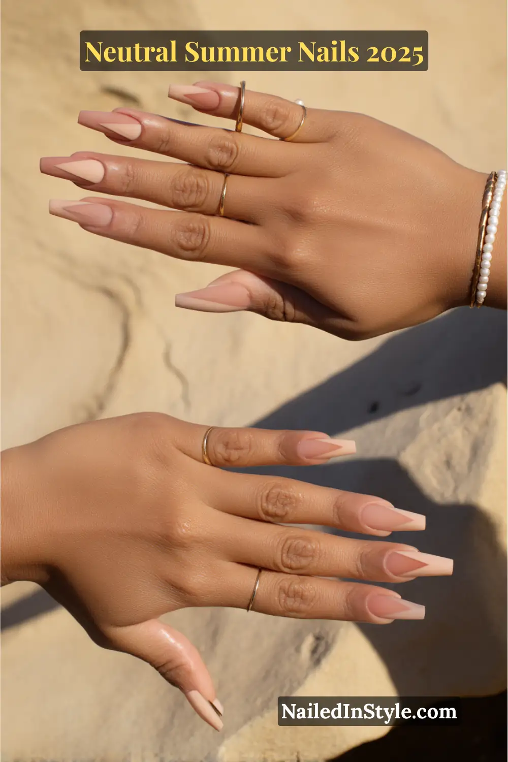 Neutral Summer Nails 2026: Clean, Chic & Warm-Weather Ready 26 Hands with long coffin-shaped nails featuring nude tone-on-tone geometric nail art, set against a sandy background with gold rings and pearl bracelets.