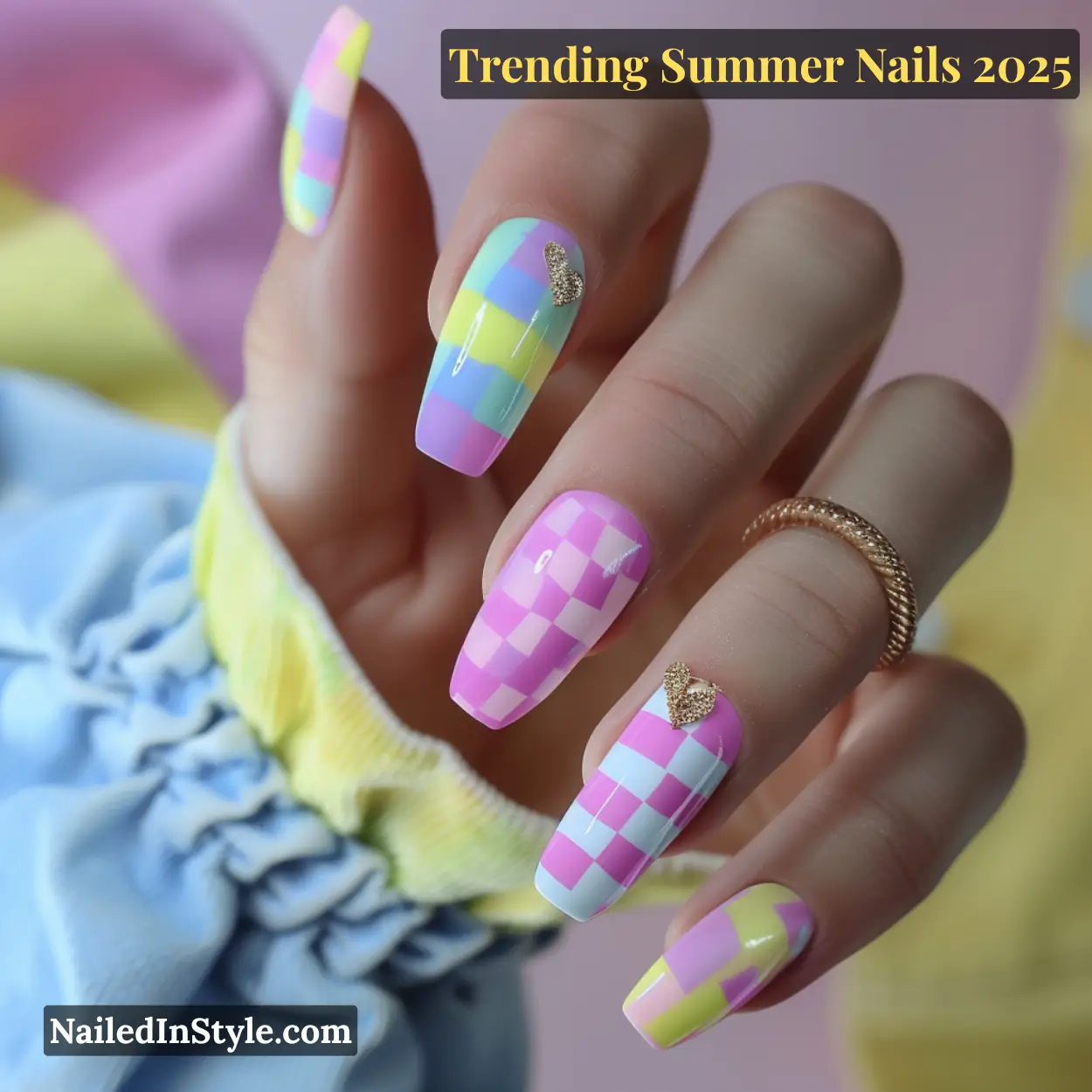 Hand with long coffin-shaped nails featuring pastel checkerboard patterns in pink, yellow, lilac, and aqua.