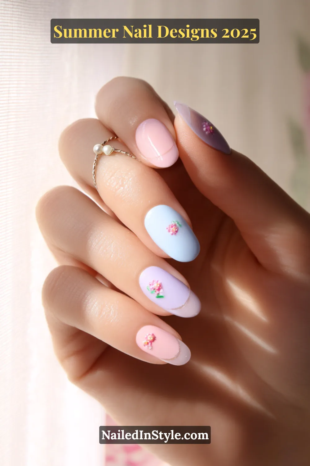 Close-up of pastel summer nails with mini floral accents and heart-inspired tips on a soft blush-toned base