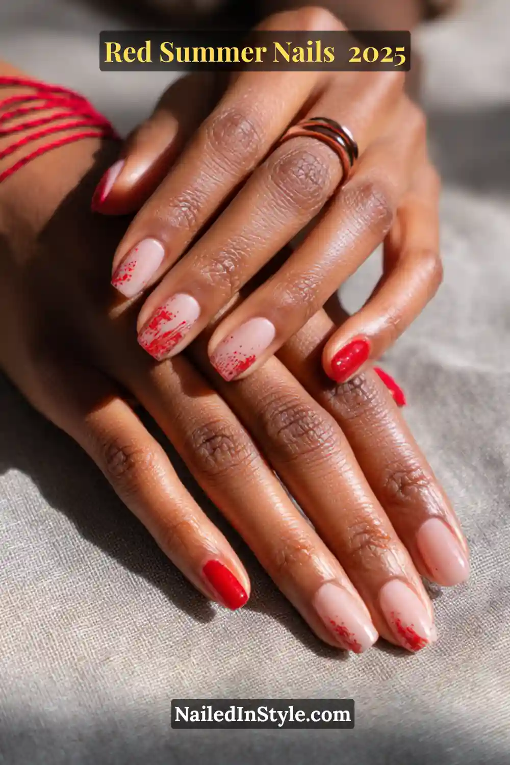 Red Summer Nails 2026: Bold, Fiery & Classic Warm-Weather Looks 19 Red summer nail design with a bold red accent nail and red splatter art on a nude matte base