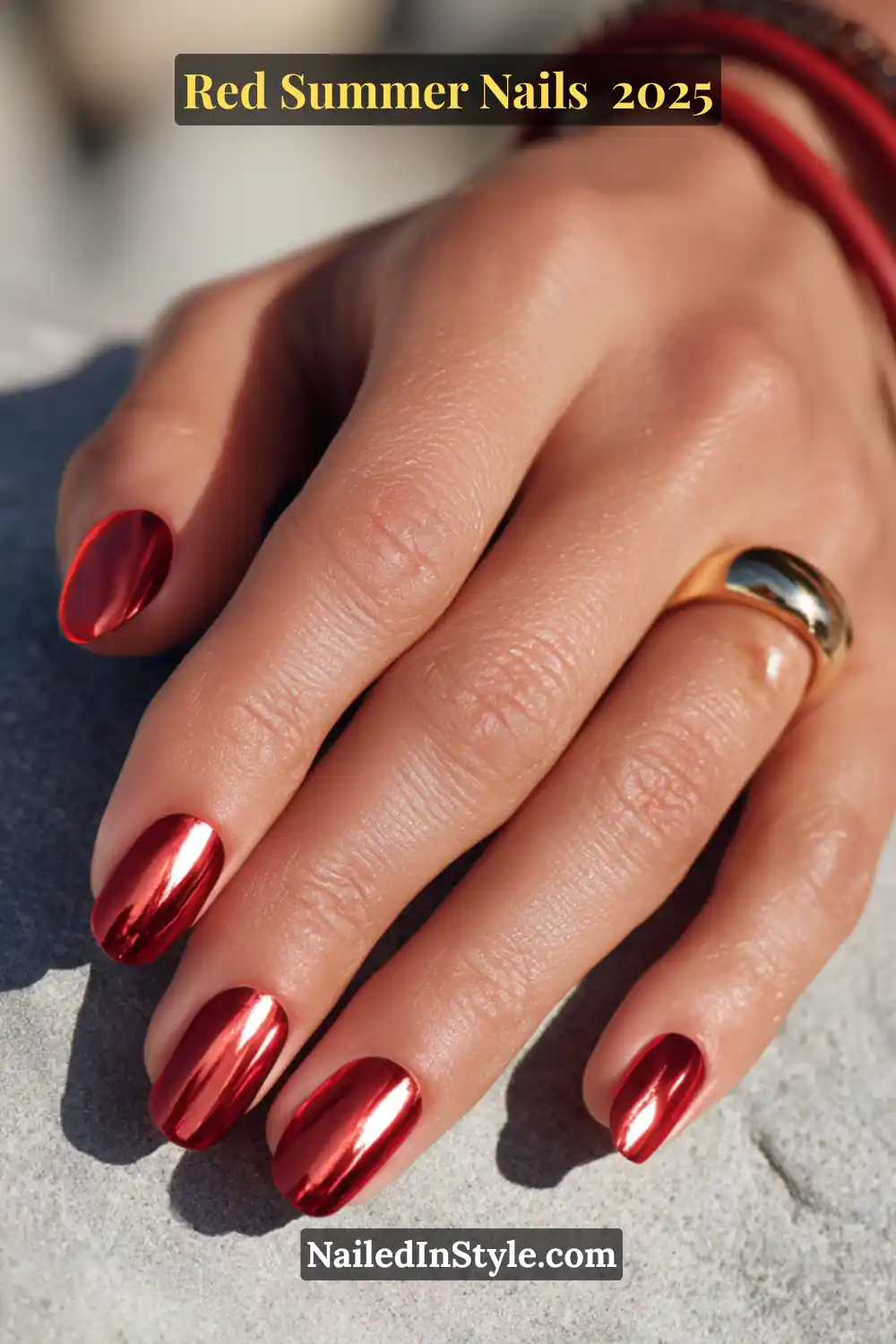 Red Summer Nails 2026: Bold, Fiery & Classic Warm-Weather Looks 15 Mirror-shine red chrome nails on natural oval tips with gold statement ring and red bracelets