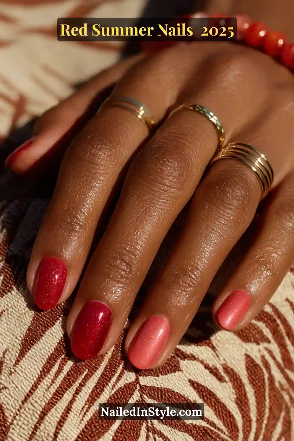 Red Summer Nails 2026: Bold, Fiery & Classic Warm-Weather Looks 3 Medium skin tone hand with glossy tomato red, watermelon pink, and scarlet shimmer summer nails
