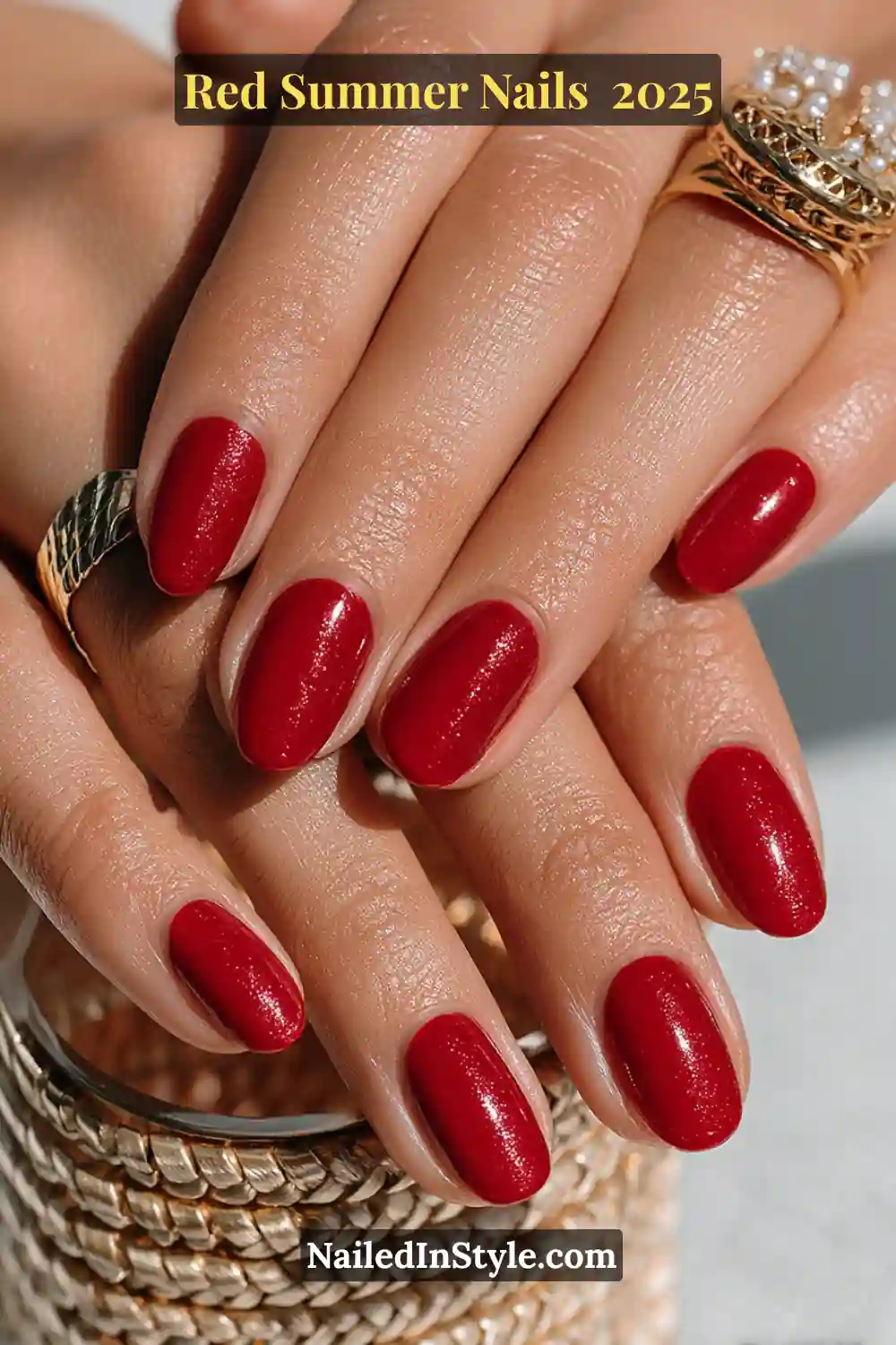 Red Summer Nails 2026: Bold, Fiery & Classic Warm-Weather Looks 1 Hands with glossy red summer nails featuring a bold and vibrant manicure with a touch of shimmer