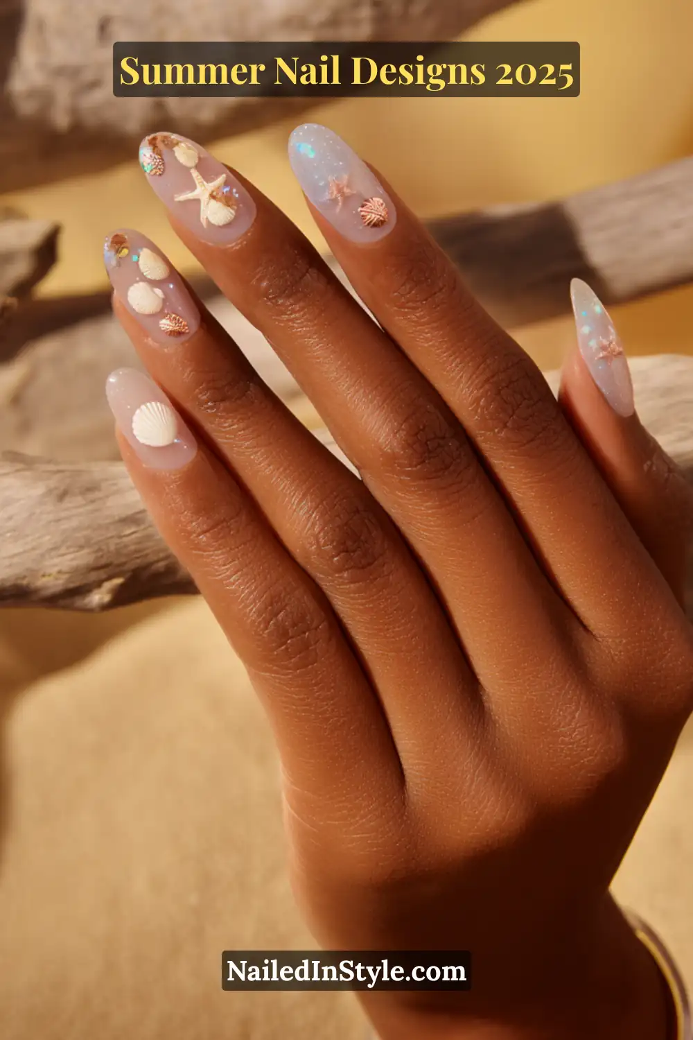 Hand with iridescent nails decorated with 3D seashell and starfish decals