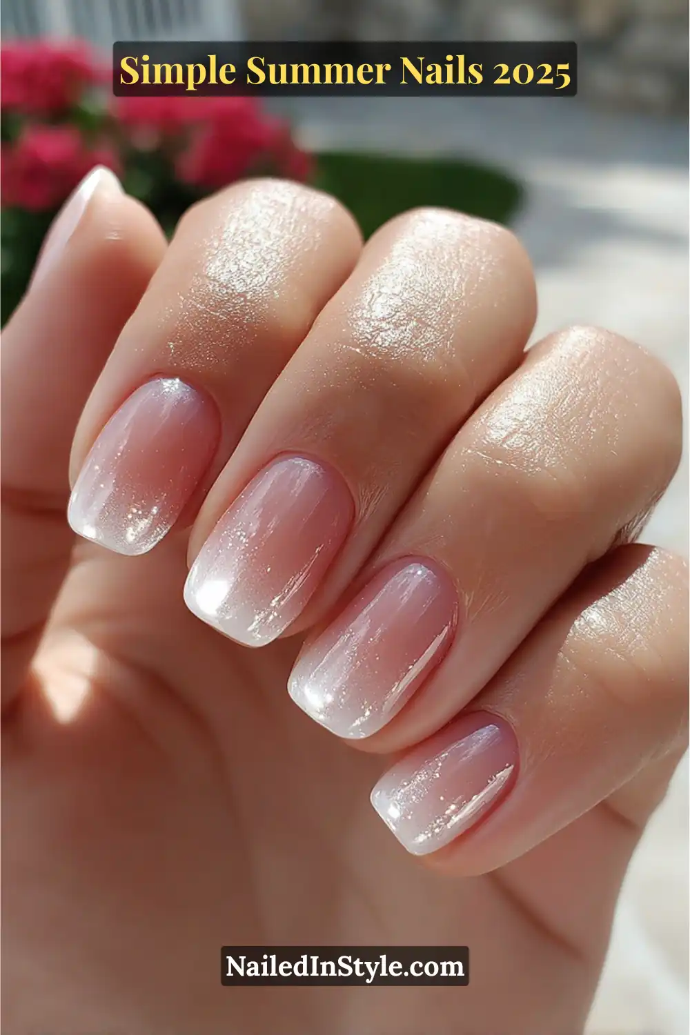 Short square nails with sheer pink and white ombré glitter finish on a natural fair hand in bright outdoor sunlight.
