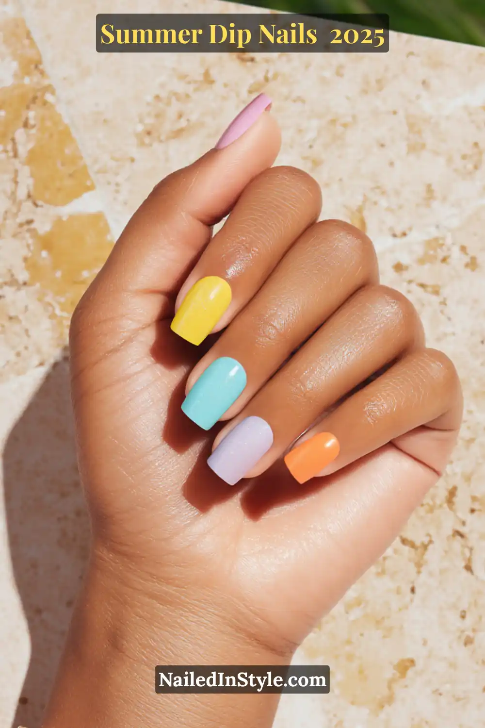 A hand with short square-shaped dip nails in tangerine, aqua, yellow, and shimmering lavender tones—perfect for olive skin.