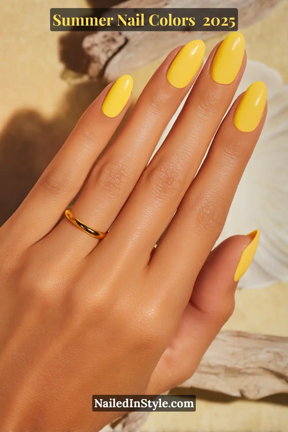 Hottest Summer Nail Colors 2026: Bold, Breezy & On-Trend 13 Close-up of medium-toned hand with almond-shaped nails painted in a vibrant lemon yellow under bright summer light.