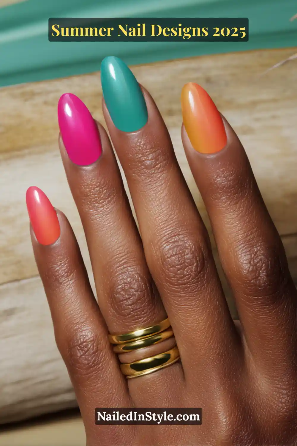 Olive-toned hand with vibrant summer nails in hot pink, tangerine orange, and ocean teal shades