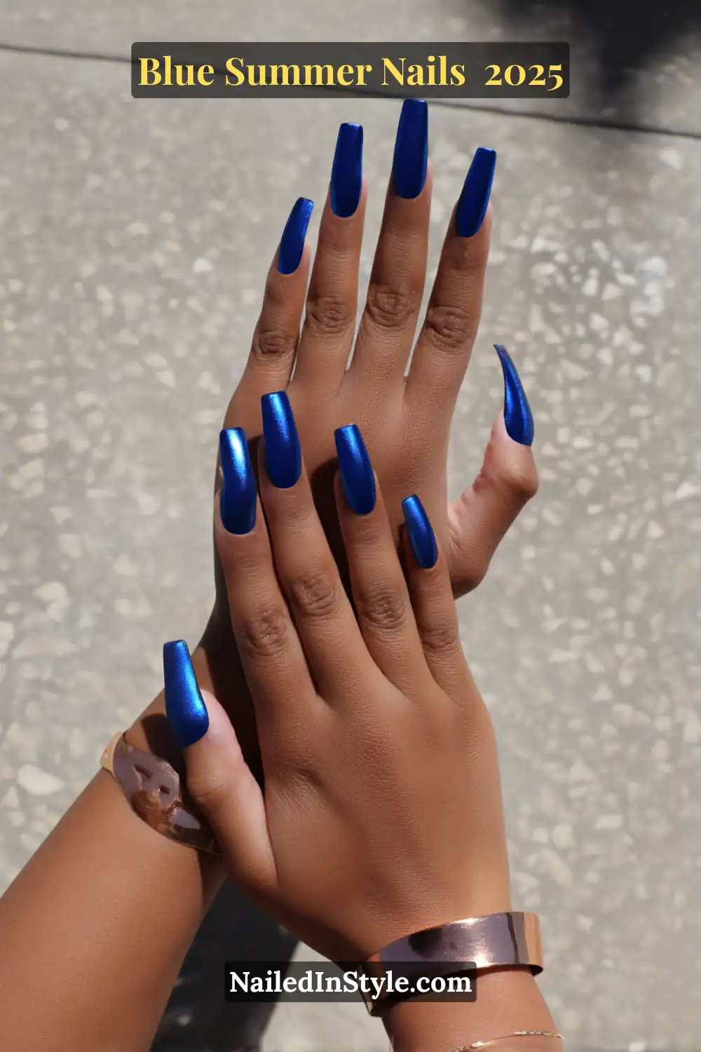 Blue Summer Nails 2025: Make a Splash with the Coolest Trends of the Season 15 Hands with long coffin-shaped nails in a reflective cobalt chrome finish, styled for summer 2025.