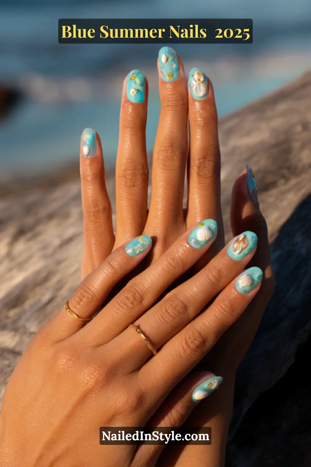 Blue Summer Nails 2025: Make a Splash with the Coolest Trends of the Season 19 Hands with turquoise blue nails featuring 3D white shell decals and gold accents, perfect for beach-inspired summer 2025 looks.
