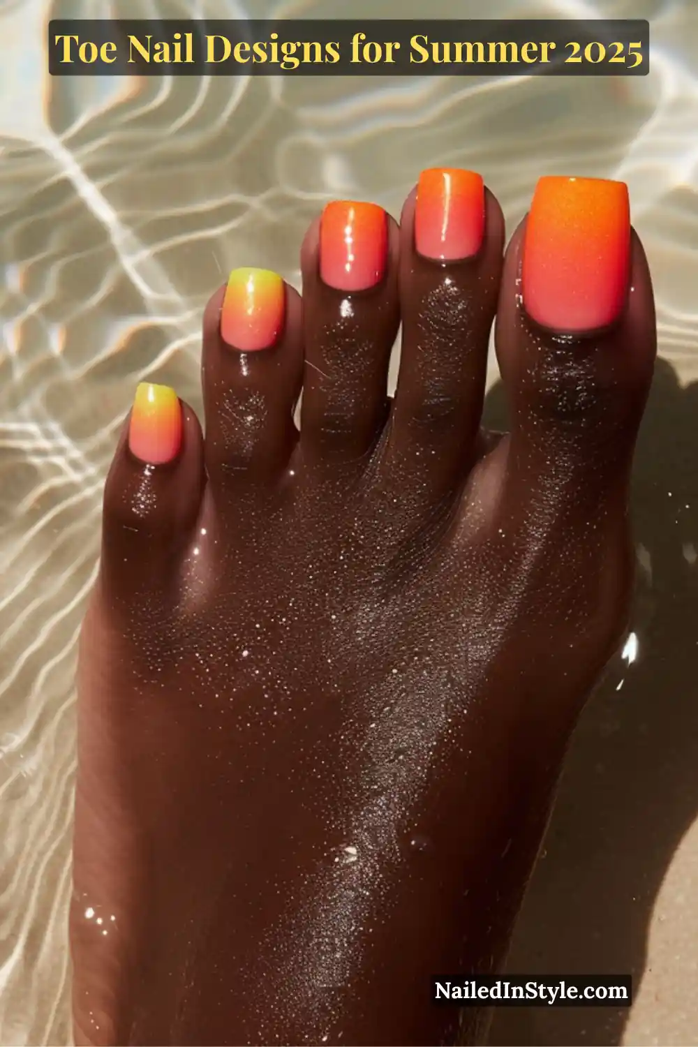 Toe Nail Designs for Summer 2026: Fresh Looks for Every Step 14 Deep-toned foot in water with glossy neon orange and yellow ombré toenails, glowing under direct sunlight