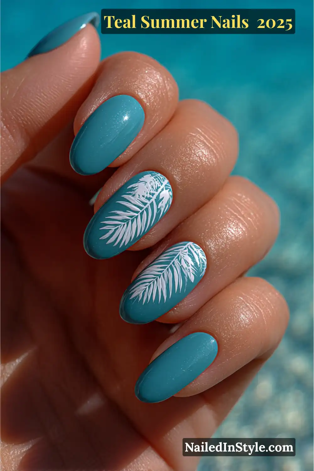 Glossy teal nails with white palm leaf accents on almond-shaped nails, set against a turquoise tropical water background
