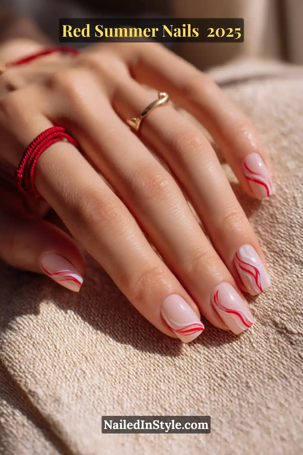 Red Summer Nails 2026: Bold, Fiery & Classic Warm-Weather Looks 26 Hand with nude square nails featuring red and white abstract wavy line design for summer 2025
