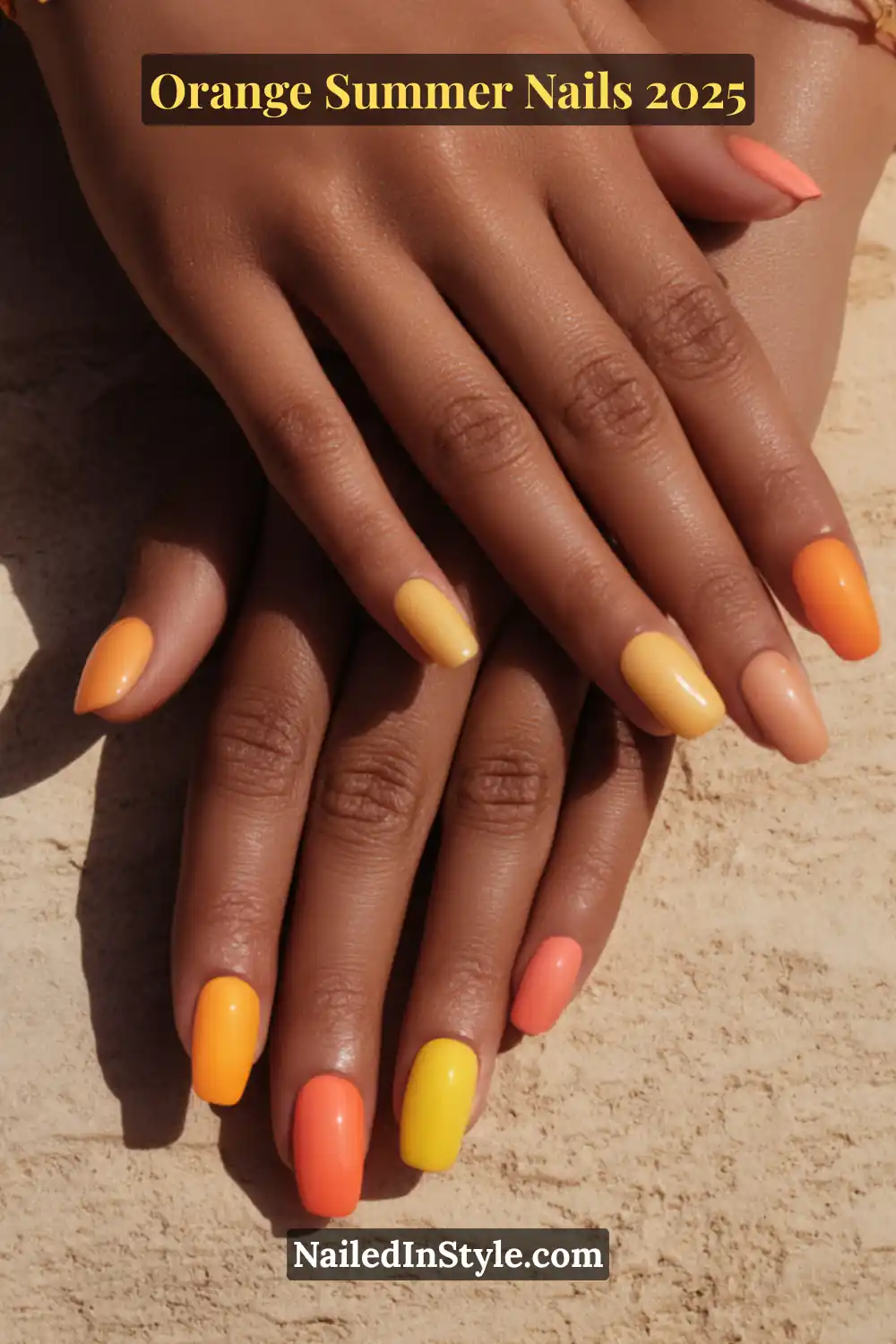 Medium skin hands with vibrant summer nails in shades of mango, sunset orange, coral, and tangerine, set against warm stone texture.