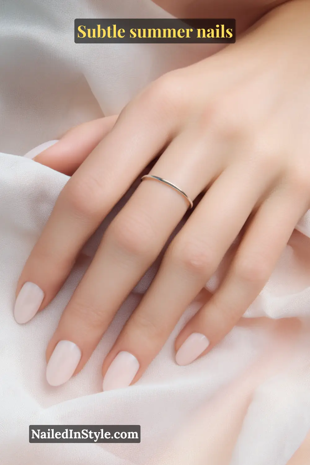Natural almond-shaped nails with a sheer pink polish, creating a delicate, minimalist summer manicure.