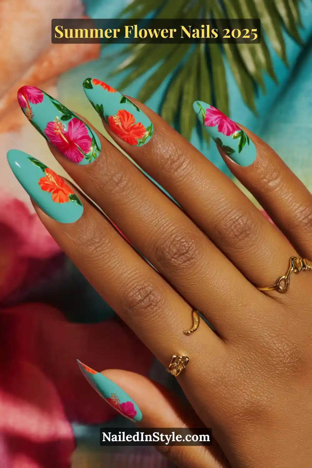 Turquoise summer nails with hand-painted bright orange and fuchsia hibiscus flowers.
