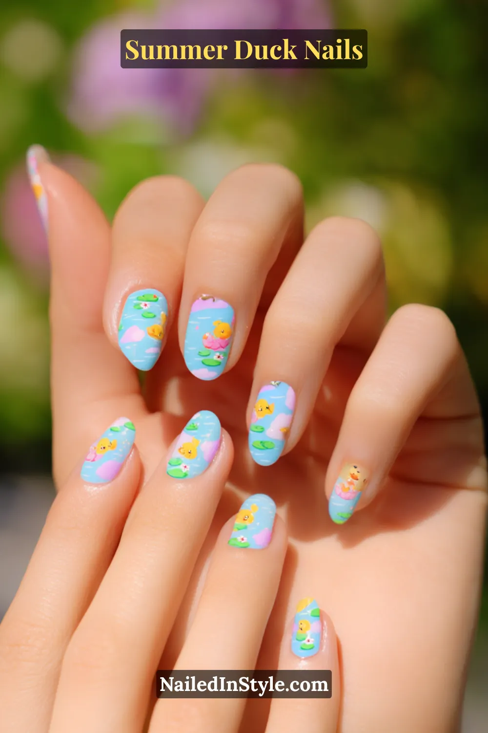 Cute Summer Duck Nails You’ll Want in 2026 19 Light blue nails with detailed cartoon ducks, lily pads, and pond ripples.