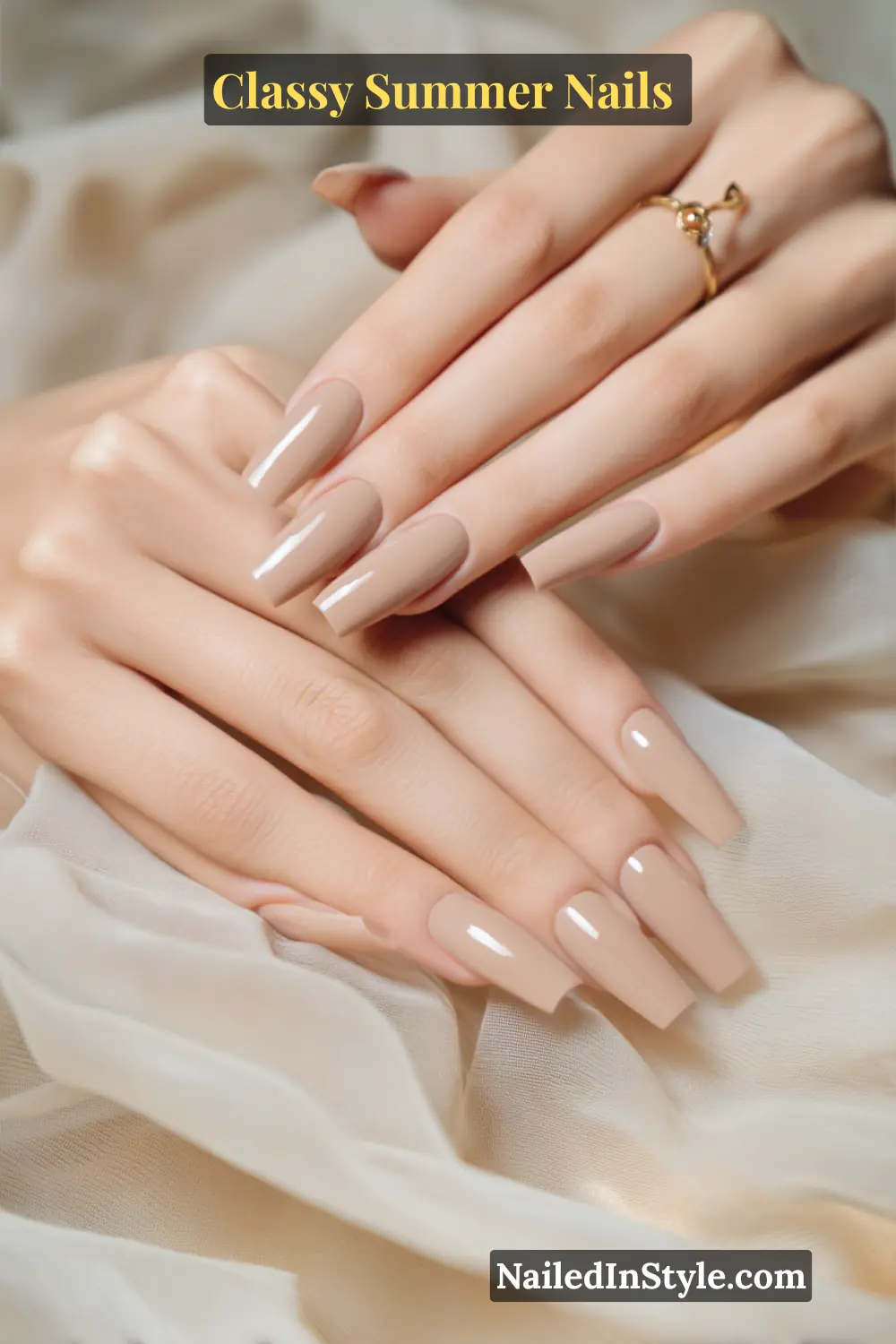 Classy Summer Nails 2026 Trends You’ll Love 12 Long coffin-shaped neutral latte nude nails with a sleek high-gloss finish, creating a timeless and elegant summer manicure.