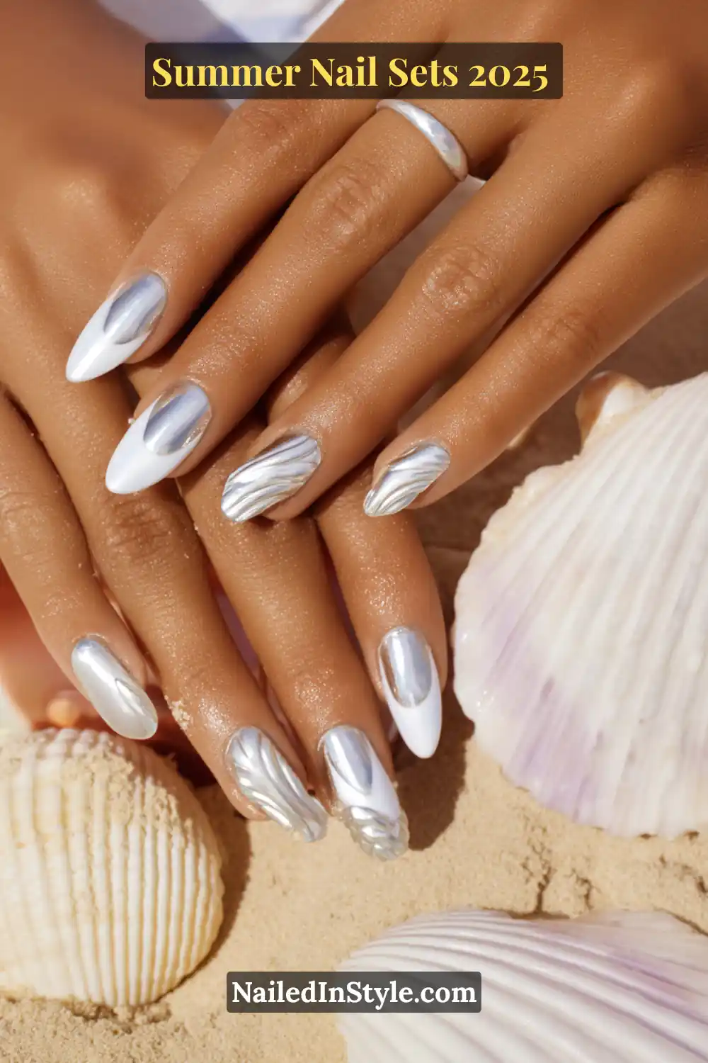 Stunning Summer Nail Sets You’ll Want This Season 17 Elegant summer nails featuring cloud white almond tips with metallic chrome seashell-inspired designs.