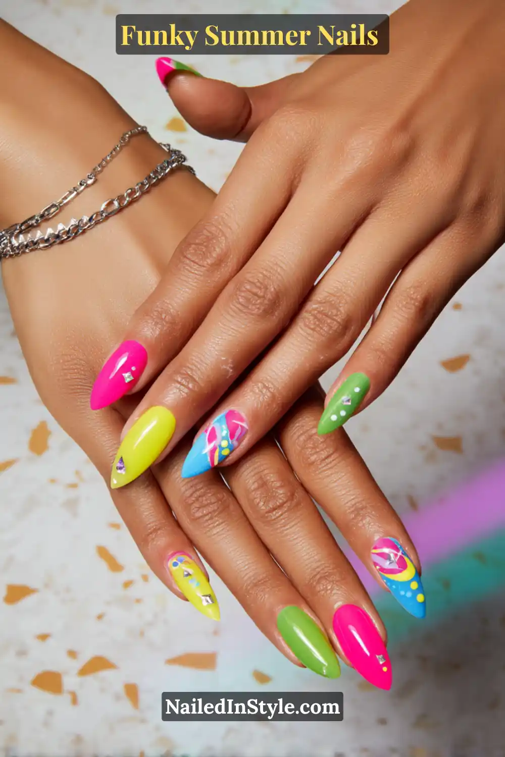 Close-up of stiletto-shaped nails in aqua blue, coral pink, lime green, and sunshine yellow. Some nails feature funky palm-inspired doodles, geometric accents, and playful dot detailing, evoking tropical coastal vibes.