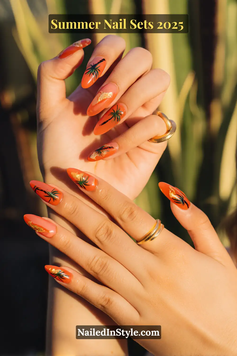 Stunning Summer Nail Sets You’ll Want This Season 12 Coral almond-shaped nails featuring hand-painted palm tree art and shimmering gold foil accents, perfect for a tropical summer look.