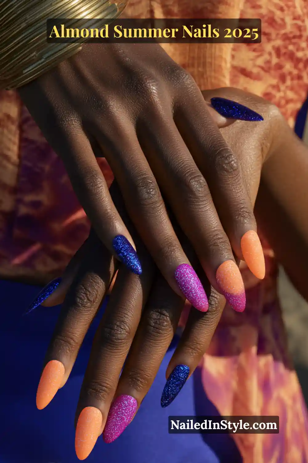Almond Summer Nails 2025: Sleek, Stylish & Seriously Stunning 11 Deep skin with almond-shaped nails in matte neon orange, glitter cobalt blue, and high-shine magenta