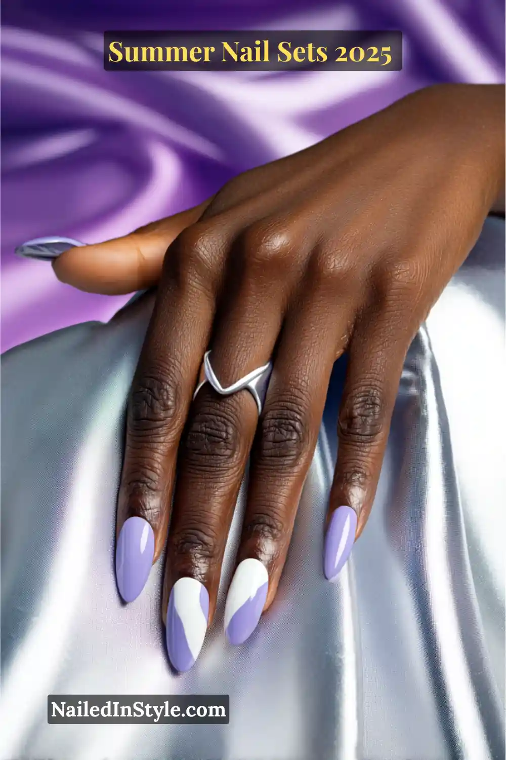 Stunning Summer Nail Sets You’ll Want This Season 11 Almond-shaped nails in lavender and cloud white on deep skin, featuring bold color blocking for a luminous, fashion-forward summer look.