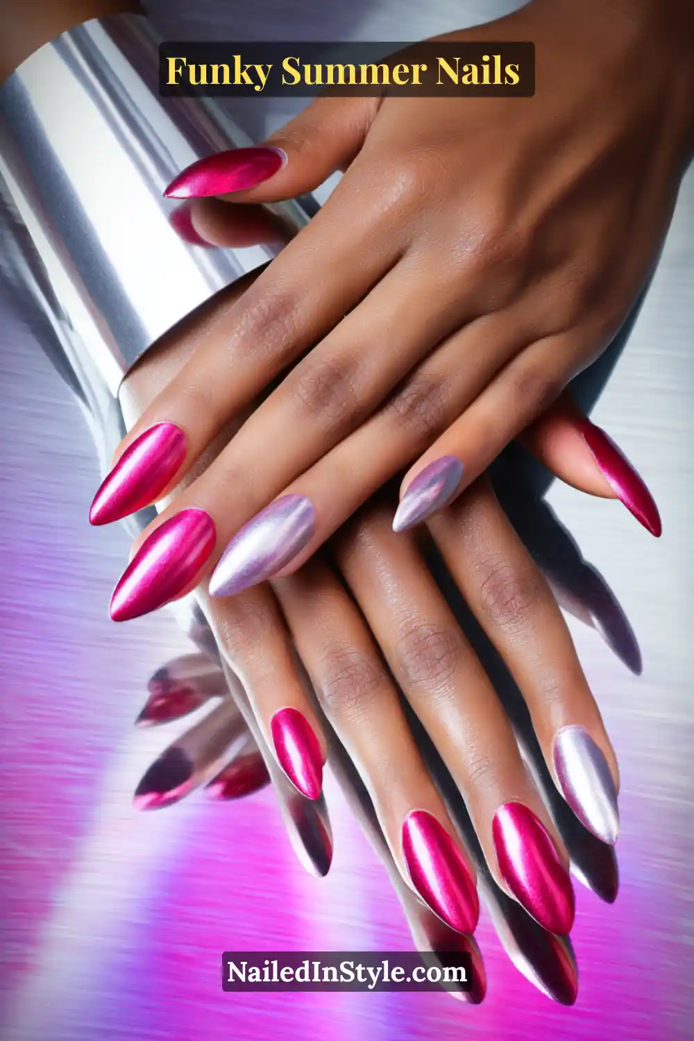 Close-up of almond-shaped nails on deep skin painted in a mix of holographic silver and metallic fuchsia. The high-shine chrome finish creates a bold contrast that radiates glamour.