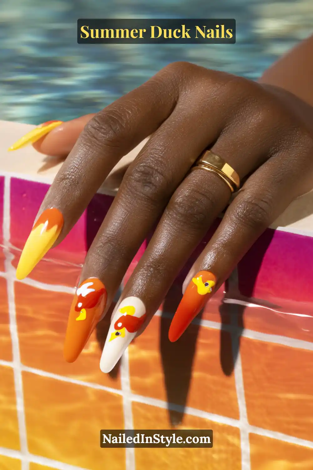 Cute Summer Duck Nails You’ll Want in 2026 11 Orange and yellow nails with duck designs, creating a striking summer statement for deep skin tones.