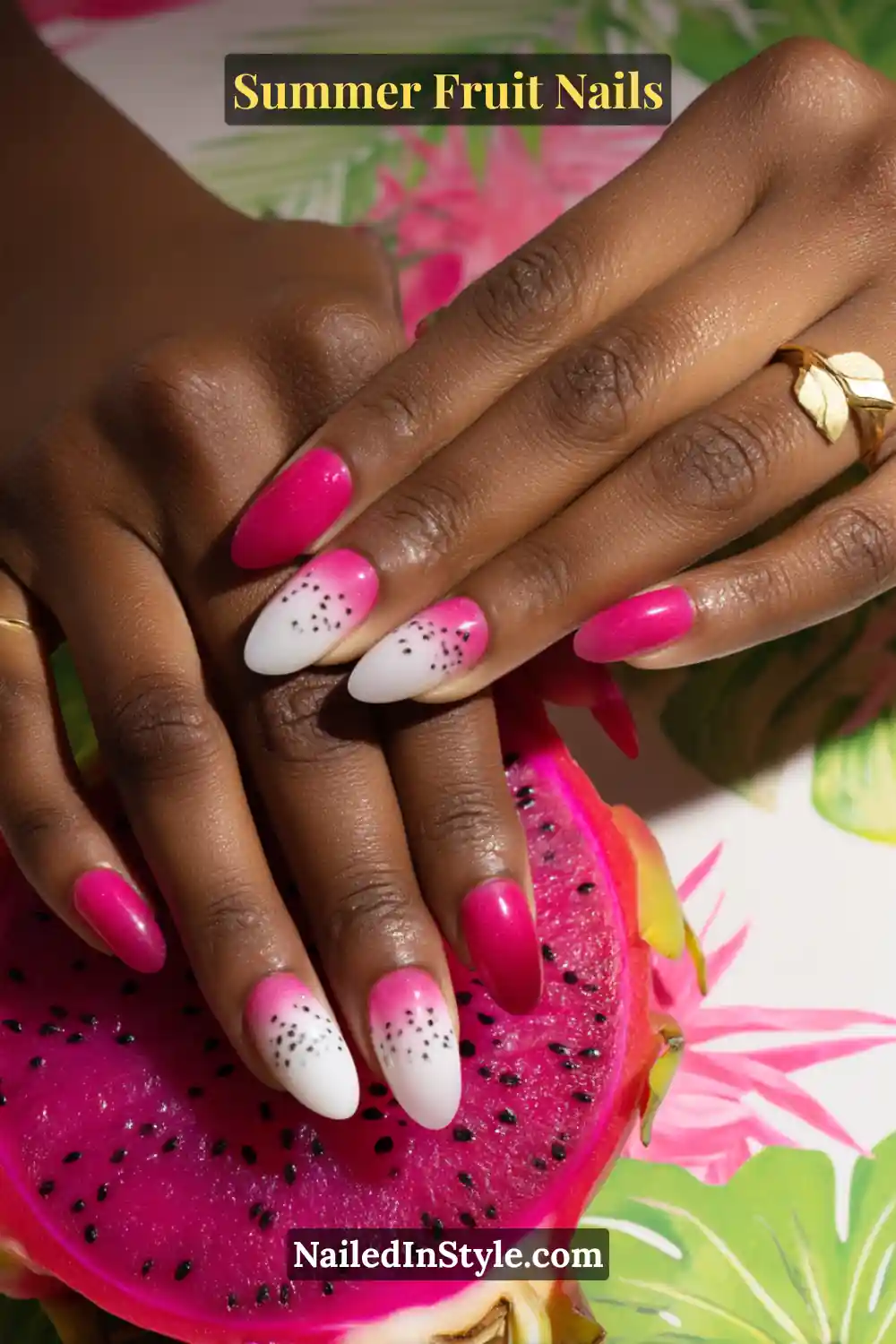 Almond-shaped nails with a white-to-pink gradient, accented with scattered black seed-like dots, inspired by dragon fruit.