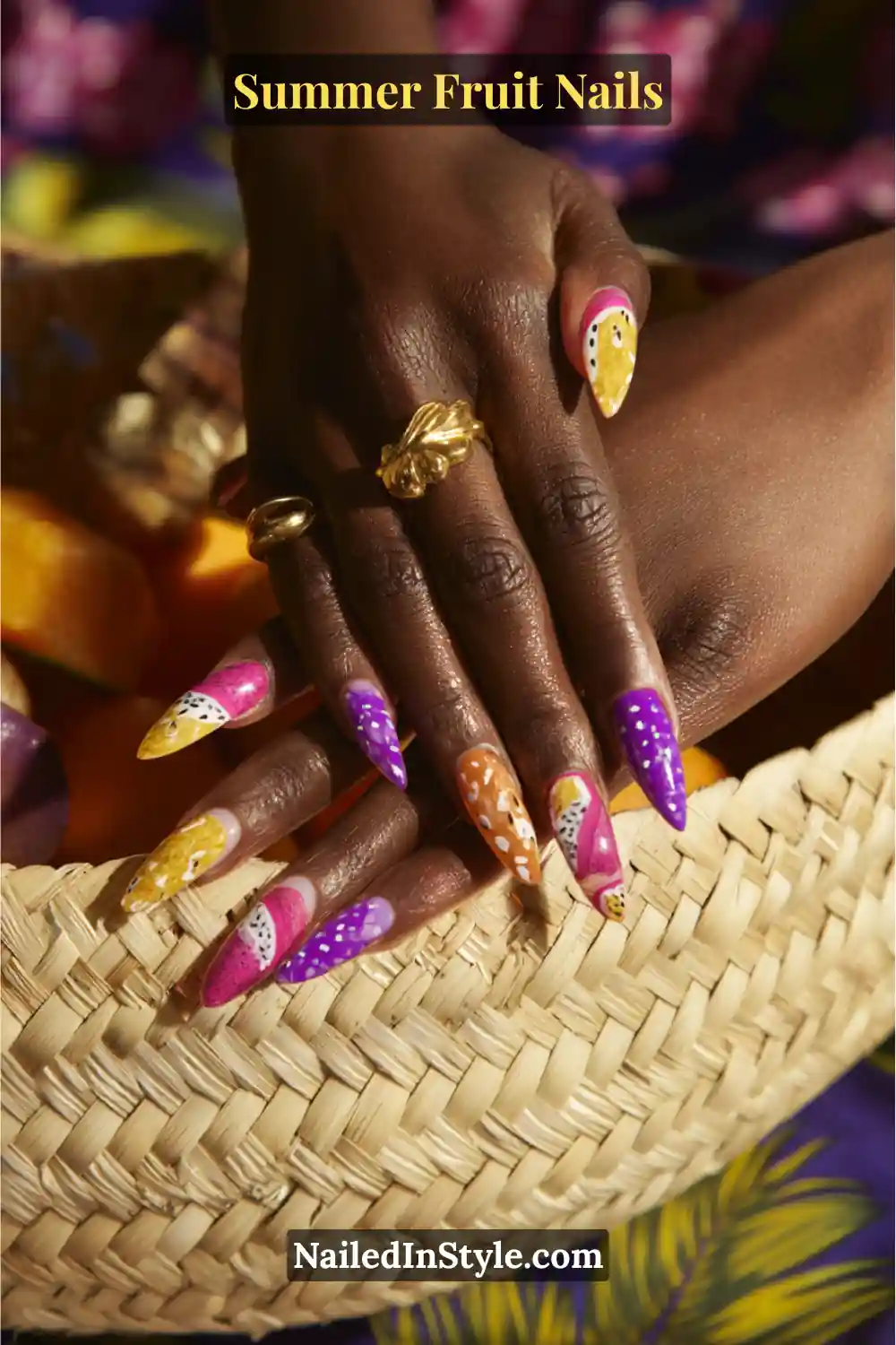 Bold purple, yellow, and pink nails featuring dragon fruit and passionfruit-inspired details.