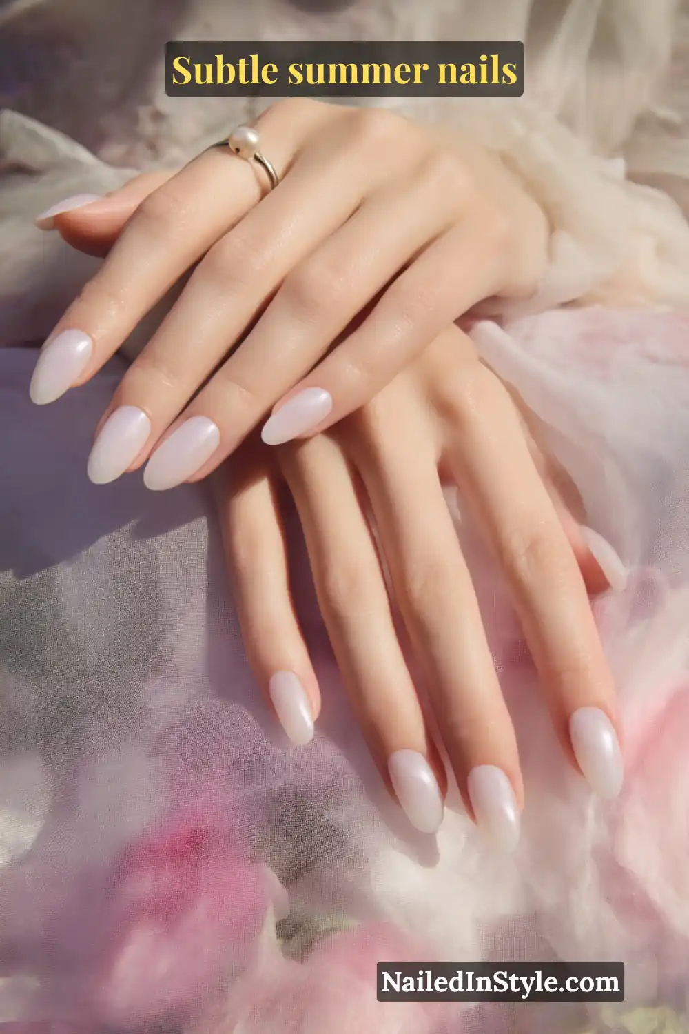Almond-shaped nails in baby pink and pearl white, designed to complement fair skin tones with a delicate, luminous finish.