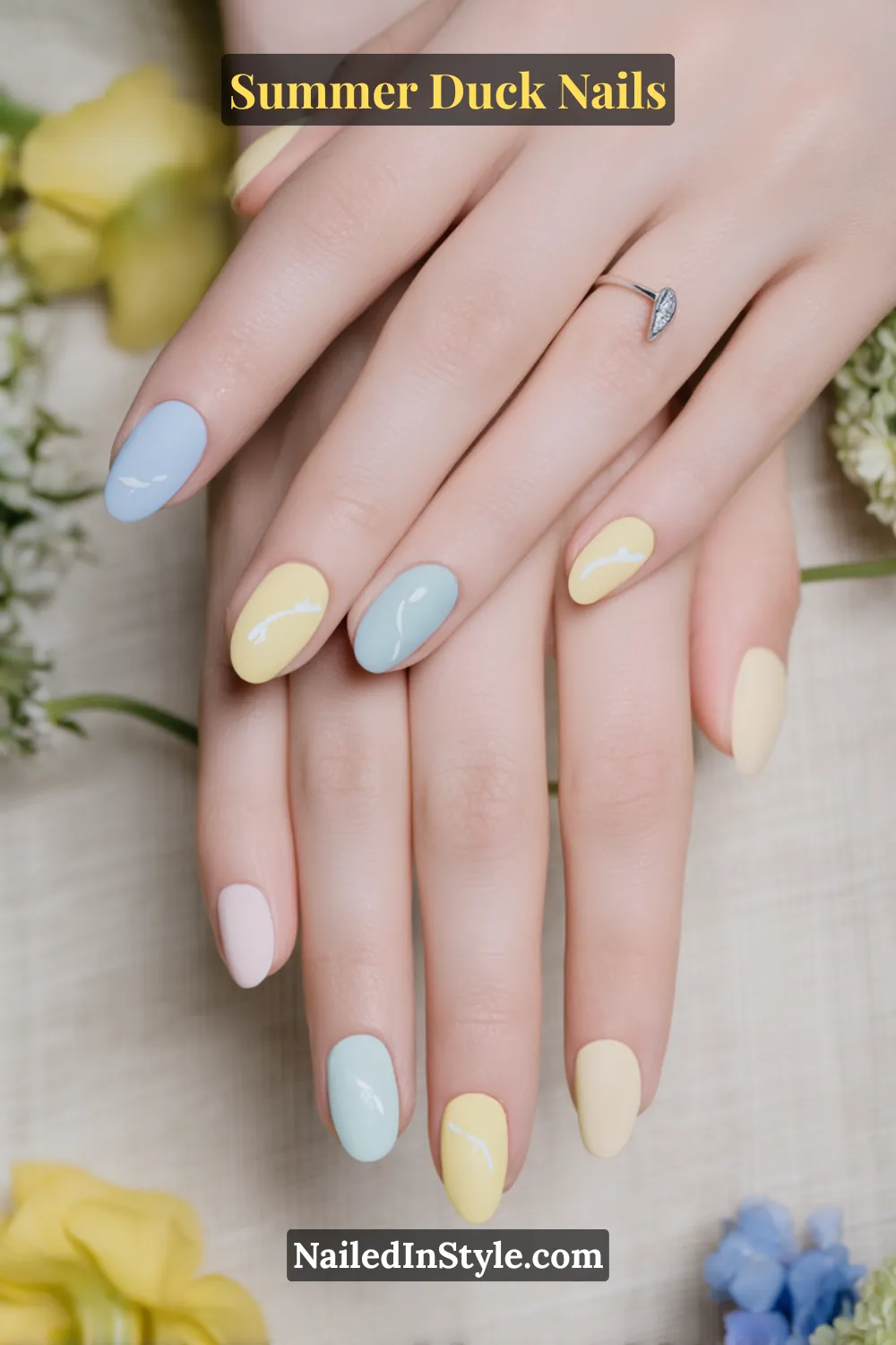 Cute Summer Duck Nails You’ll Want in 2026 7 Soft pastel baby blue, yellow, and pink nails designed for fair skin tones, with a smooth glossy finish.