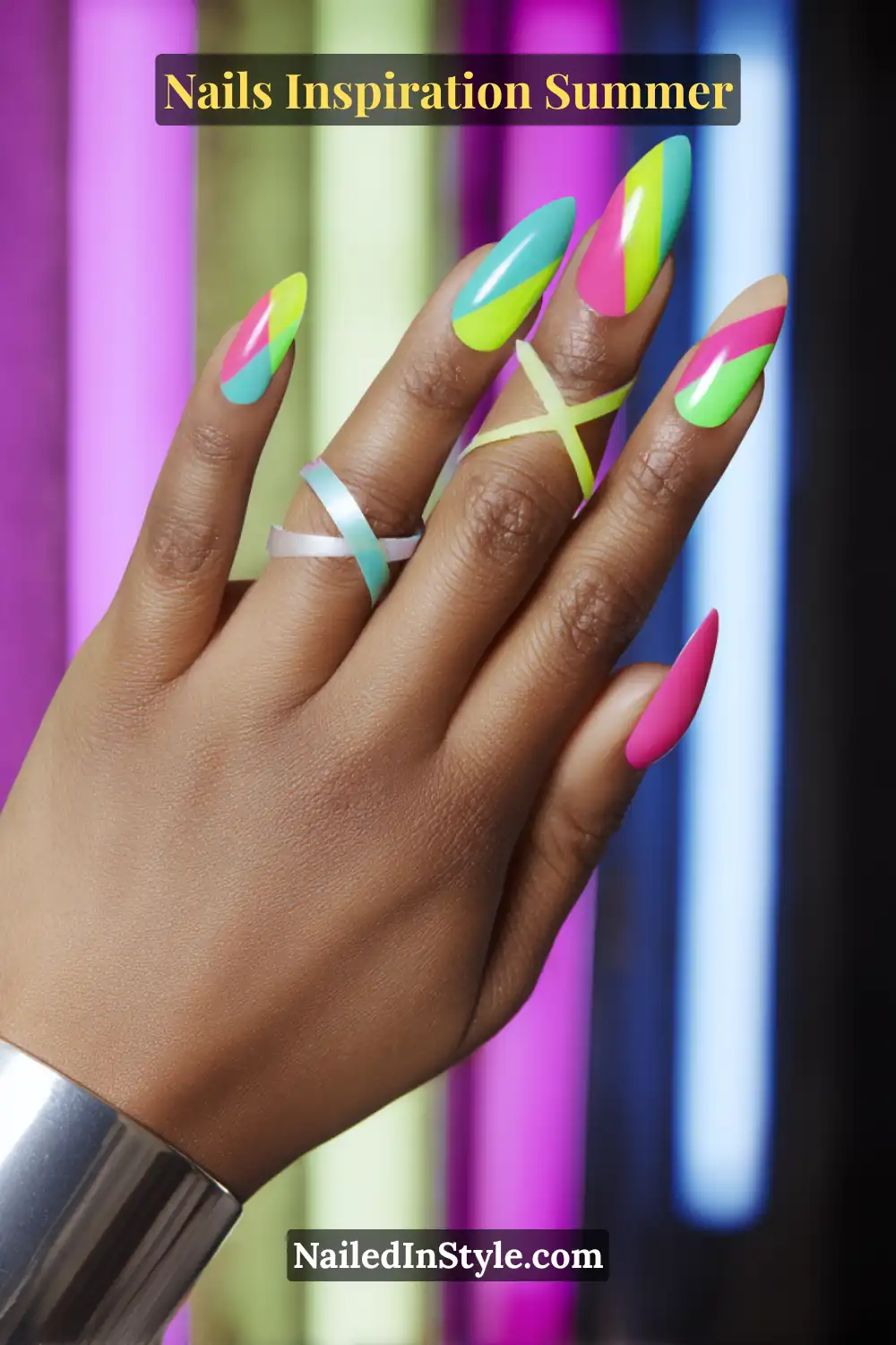 Nails Inspiration Summer 2025: Fresh Trends & Chic Ideas 2 Hand with neon festival nails in pink, lime, and aqua featuring bold geometric patterns, perfect for summer party vibes.