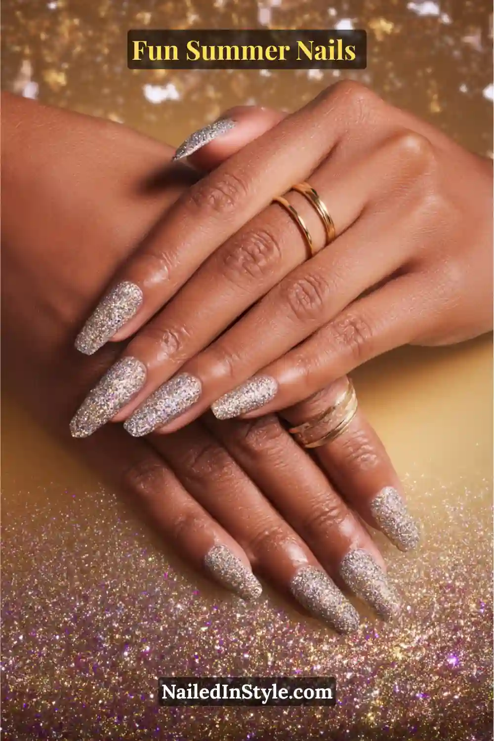 Hands with glitter glam summer nails featuring sparkling silver, gold, and multicolor glitter polish for a dazzling effect.