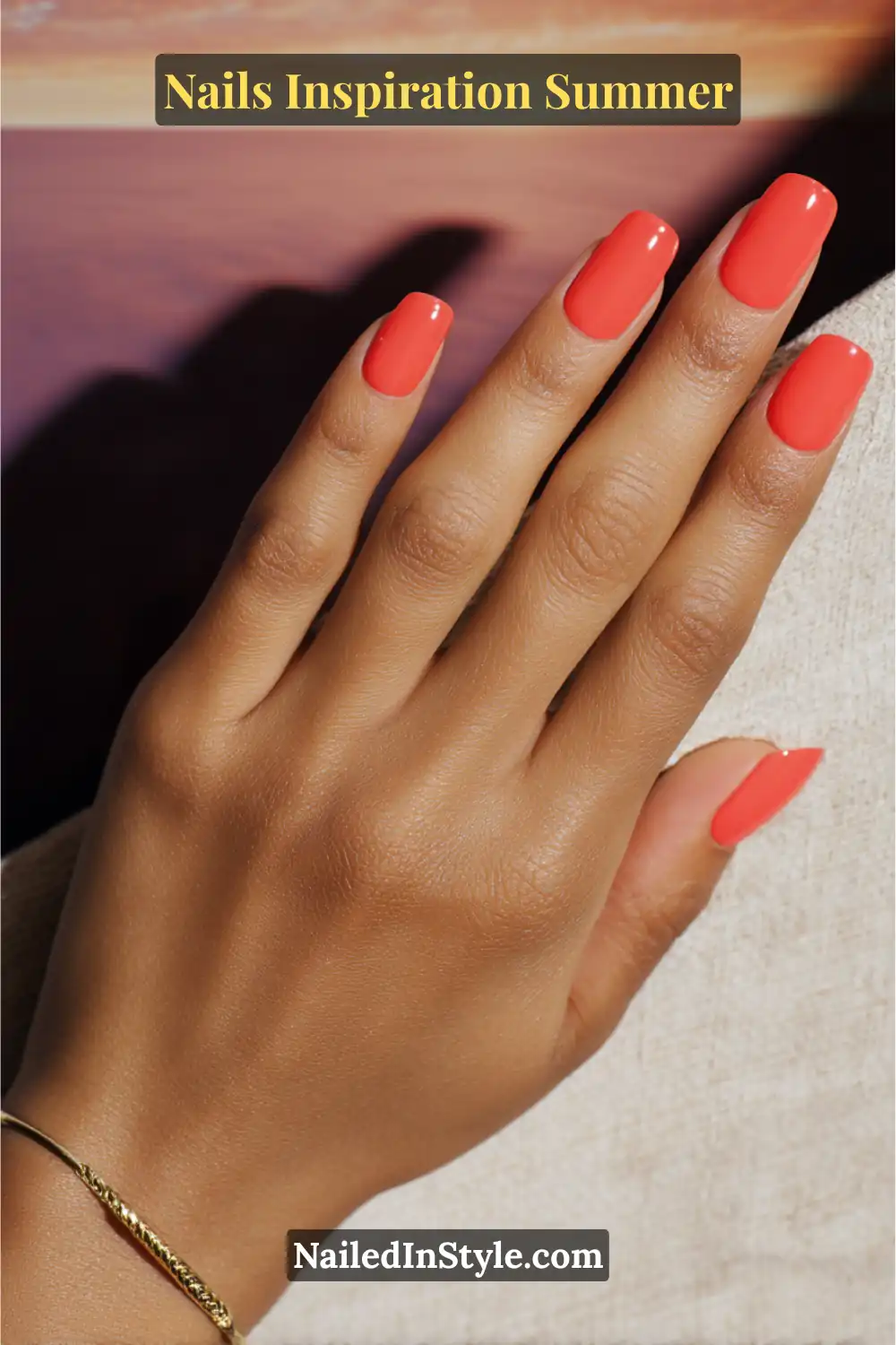 Nails Inspiration Summer 2025: Fresh Trends & Chic Ideas 20 Close-up of medium-length square nails painted in a solid glossy coral shade, creating a vibrant and polished summer manicure.