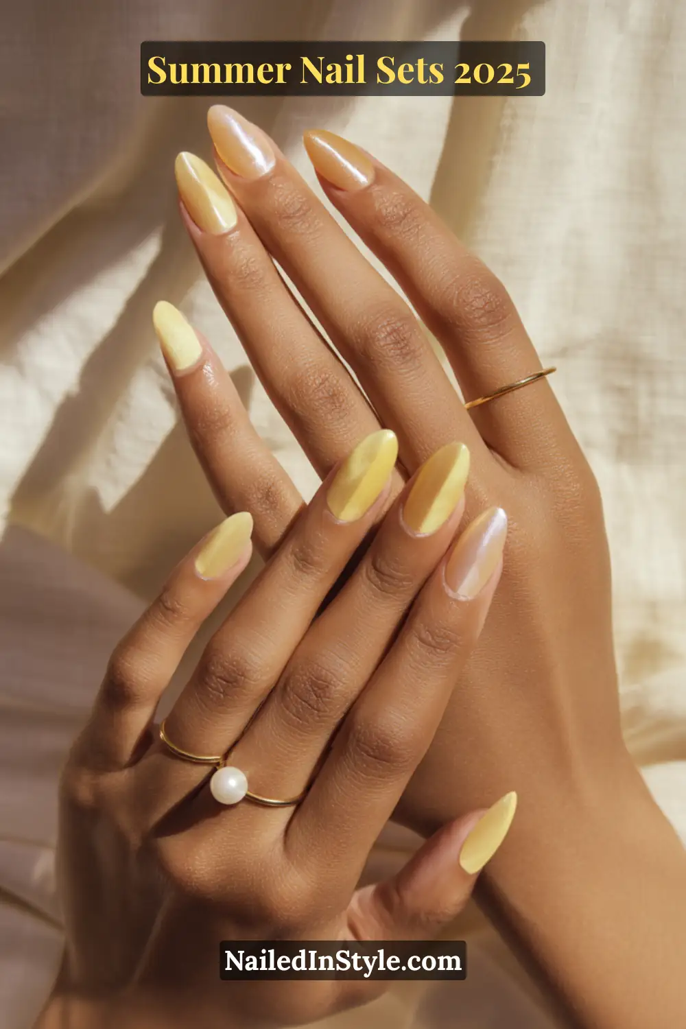 Stunning Summer Nail Sets You’ll Want This Season 8 Elegant almond-shaped nails in butter yellow and pearl on light skin tone, paired with minimalist gold rings and a pearl accent, summer nail trend 2025.